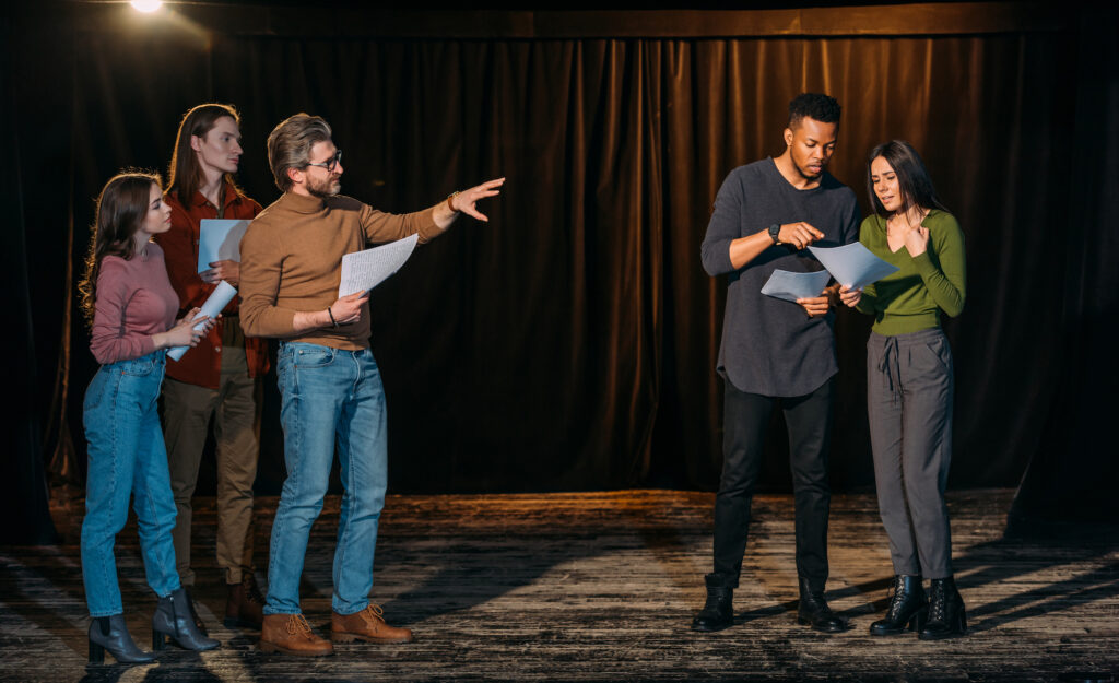 Actors on stage at a theatre