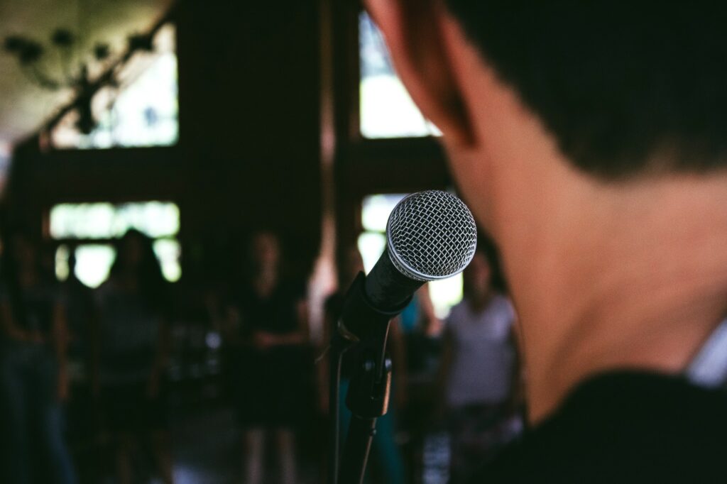 Man speaking at a microphone
