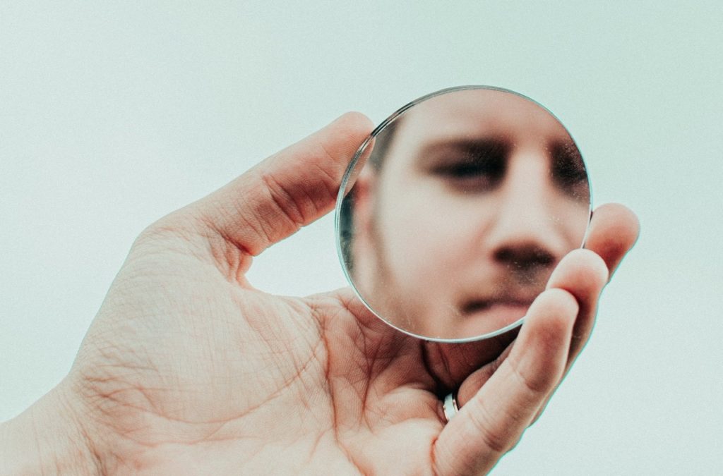 Person looking in a mirror