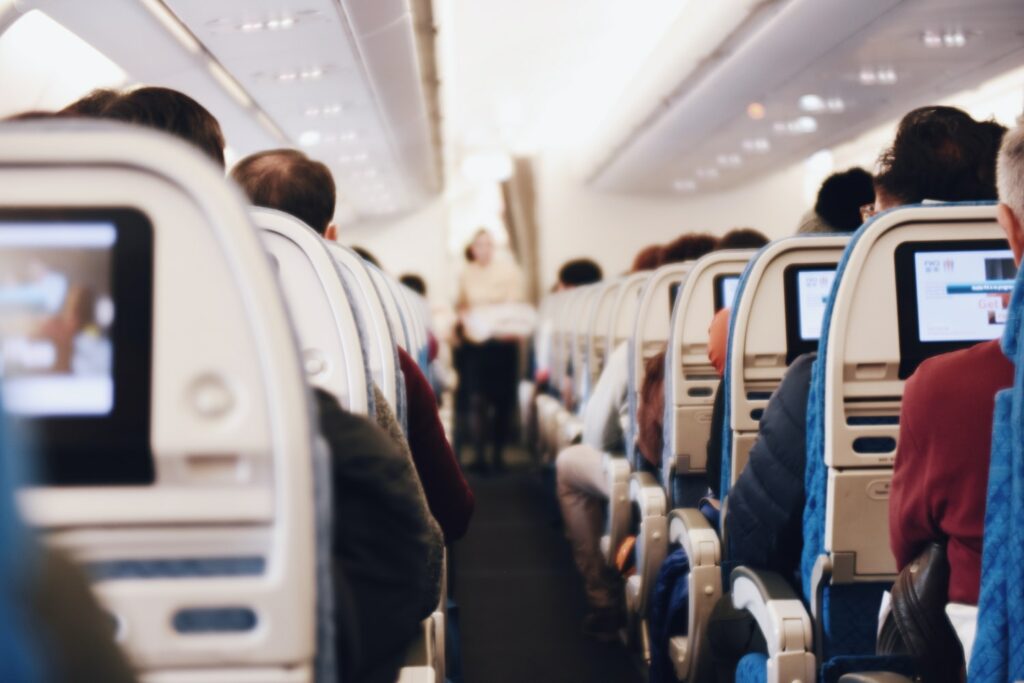 Airplane interior with people in seats